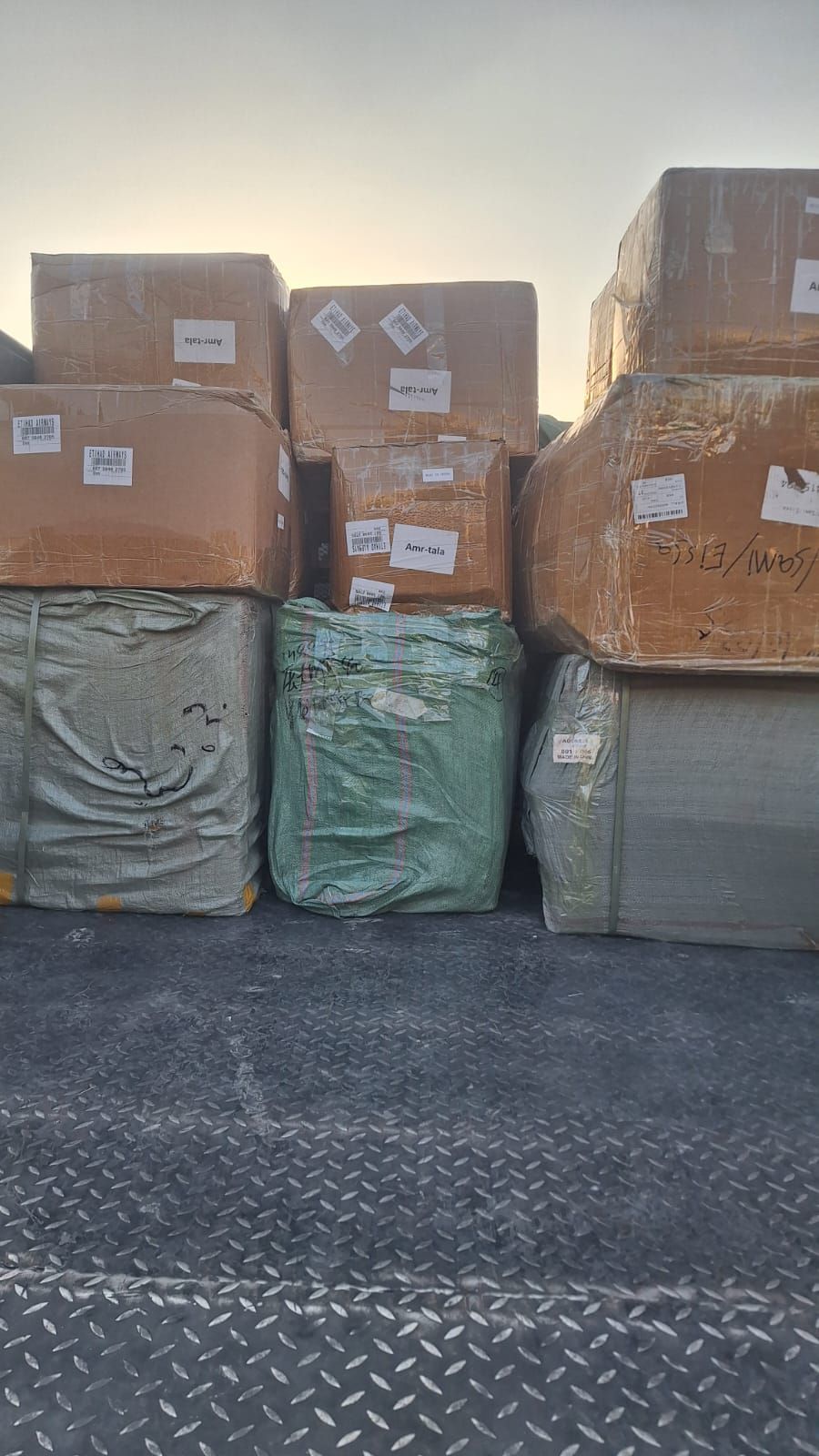 Cartons and bags loaded together before delivery